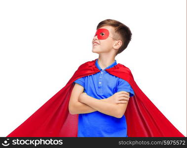 carnival, childhood, power, gesture and people concept - happy boy in red super hero cape and mask