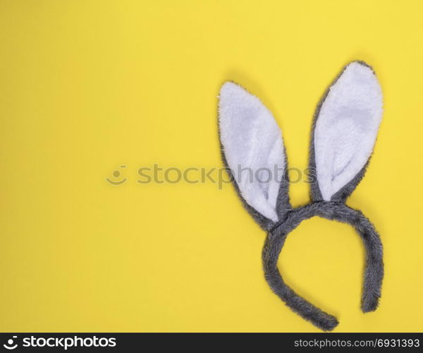 Carnival fur hare head-dress on a yellow background, the empty space to the left