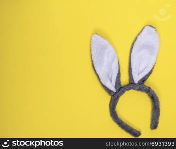 Carnival fur hare head-dress on a yellow background, the empty space to the left