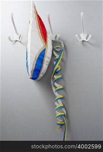 Carnival hat and streamer on hooks