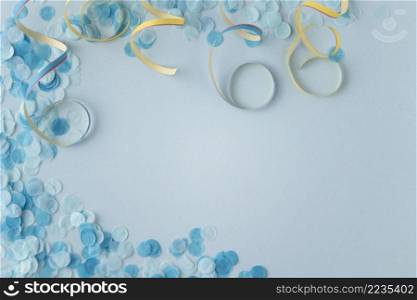 carnival paper blue confetti ribbons copy space