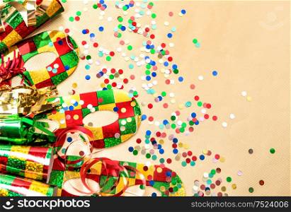 Carnival party mask, confetti and streamer decoration. Colorful holidays background