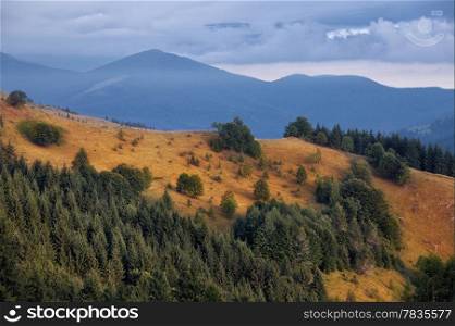 Carpathian mountain hills at cloudy sunrise. Carpathian mountains, Ukraine