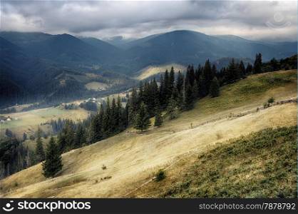 Carpathian mountain hills at cloudy sunrise. Carpathian mountains, Ukraine