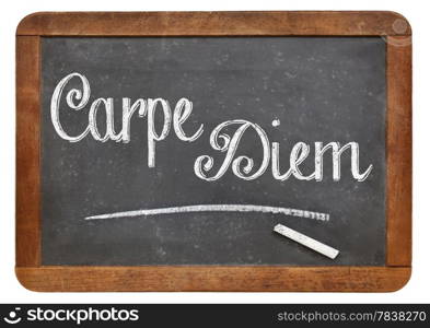 Carpe Diem handwritten with white chalk on a blackboard, isolated on white