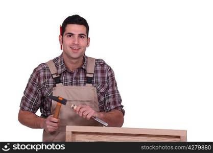Carpenter carving wood