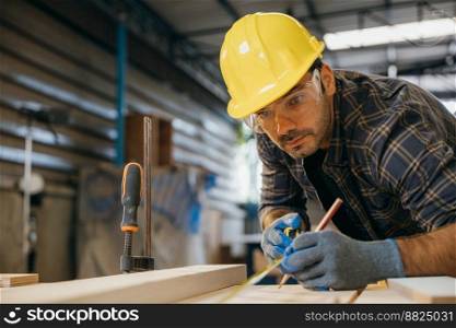 Carpenter man wear gloves during working using tape measure and pencil to make marks piece of wood board for cut on table saw at workshop or woodshop industry, woodwork, Happy Carpenter&rsquo;s Day