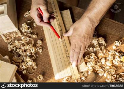 carpenter measuring with ruler pencil. High resolution photo. carpenter measuring with ruler pencil. High quality photo