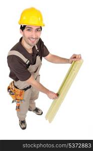 Carpenter measuring wood