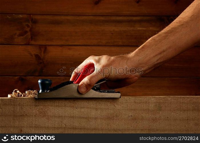 carpenter planning wood planer tool man hand wooden background