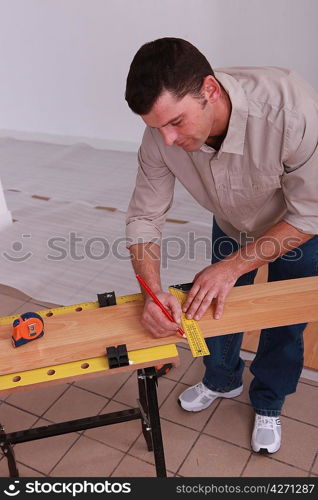 carpenter taking measurements