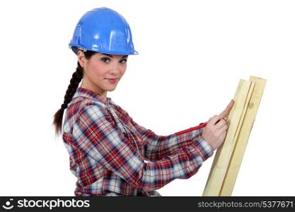 Carpenter taking measurements