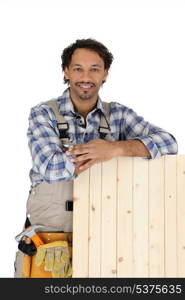 Carpenter with a wooden shutter