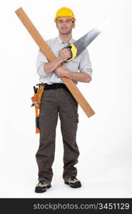 Carpenter with plank and saw