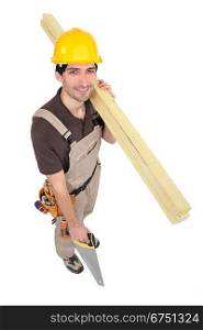 Carpenter with timber and a handsaw