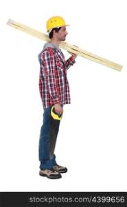 Carpenter with two planks of wood and a hand-saw