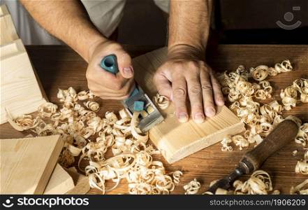 carpenter working with his bare hands wood. High resolution photo. carpenter working with his bare hands wood. High quality photo
