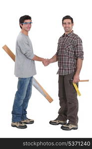 Carpenters shaking hands