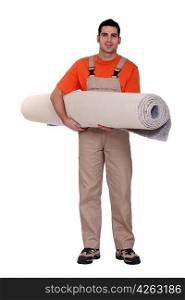 Carpet fitter carrying a roll of carpet