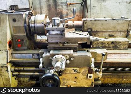 Carriage of old metal lathe machine in turning workshop