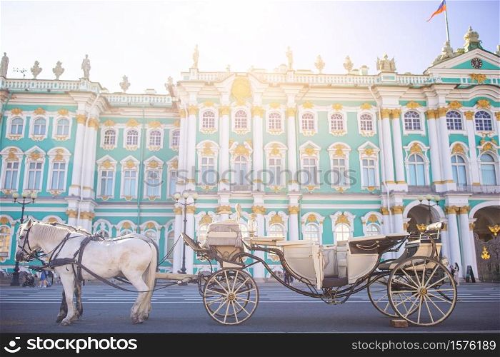 Carriage with horses on background of one of the largest and historical museums in Russia and the world. The Palace Square in St Petersburg inRussia