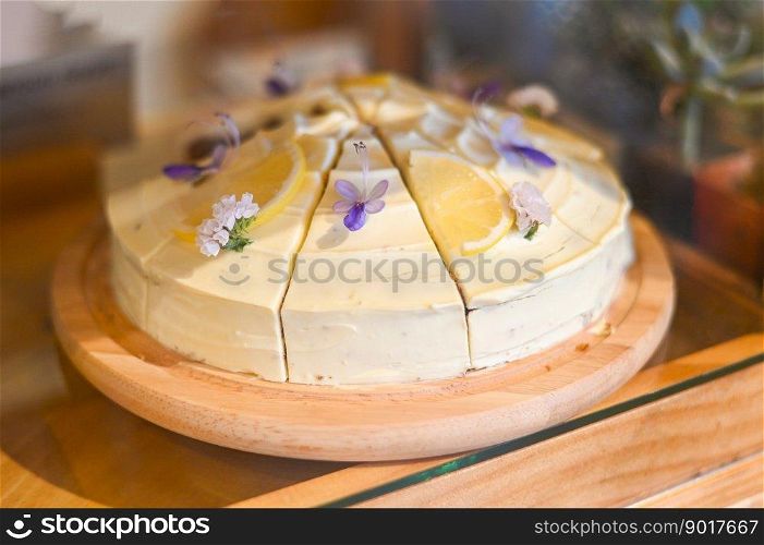 carrot cake on wooden plate, carrot cake with lemon for dessert and tea - fresh homemade carrot cake cake slice  in bakery cake shop