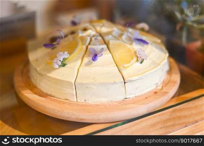 carrot cake on wooden plate, carrot cake with lemon for dessert and tea - fresh homemade carrot cake cake slice  in bakery cake shop