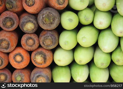 Carrot (Daucus carota) and cucumber (Cucumis sativus) for sale in market at Pune, India