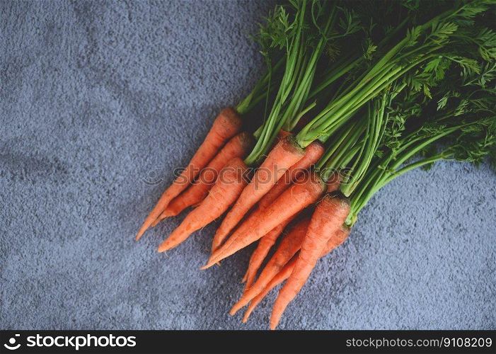 carrot on table background, Fresh and sweet carrots for cooking food fruits and vegetables for health concept, baby carrots bunch and leaf
