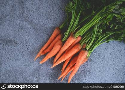 carrot on table background, Fresh and sweet carrots for cooking food fruits and vegetables for health concept, baby carrots bunch and leaf