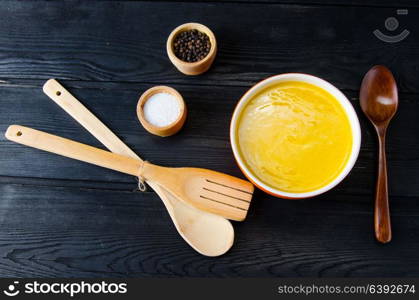 Carrot soup served on the table in bowl