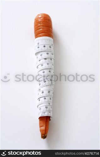 Carrot wrapped in measuring tape
