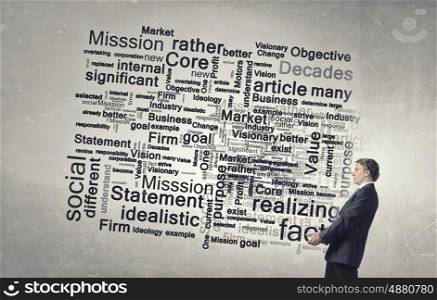 Carrying out idea. Young businessman carrying in hands business idea concept