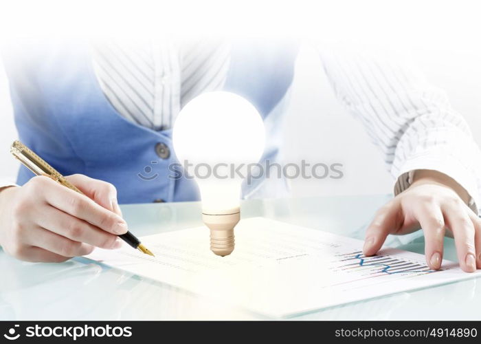 Carrying out new effective ideas. Close view of businesswoman writing down her bright ideas