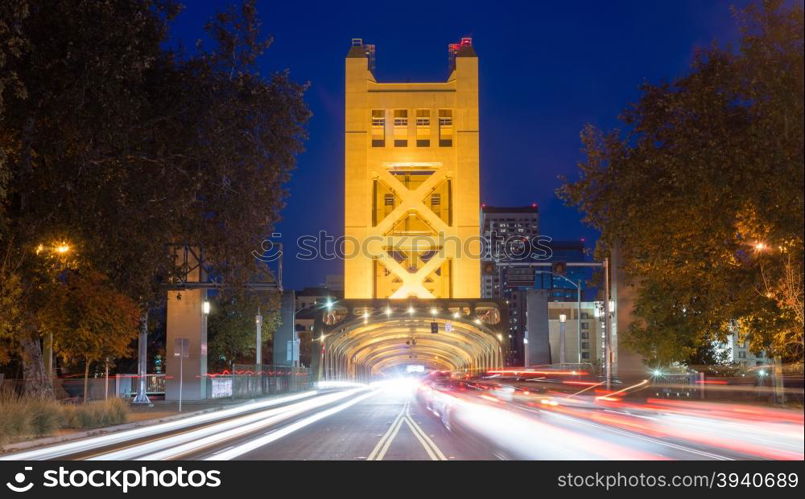 Cars come and go from the Tower Bridge at night in Sacramento