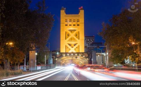 Cars come and go from the Tower Bridge at night in Sacramento
