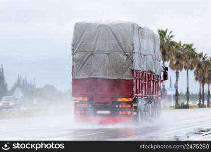 Cars driving along a wet highway in rainy weather in Turkey