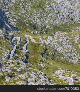 Cars driving popular among tourists beautiful winding mountain serpentine Coll dels Reis, Mallorca, Spain