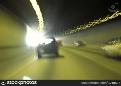 Cars Driving Through Tunnel