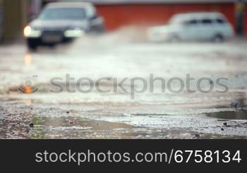 cars on flooded road in the city