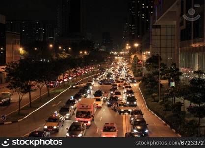 Cars on the night road in the center of Singapore