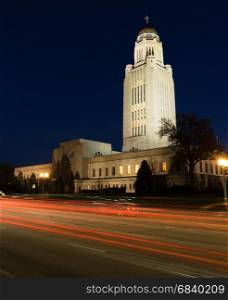 Cars Sreak By at Night in front of Lincoln Nebraska State Capital Building