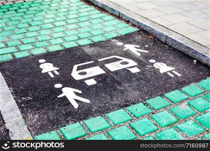 Carsharing vehicle parking sign on asphalt road of Munich, Germany, Europe. Modern rental ideology transport concept