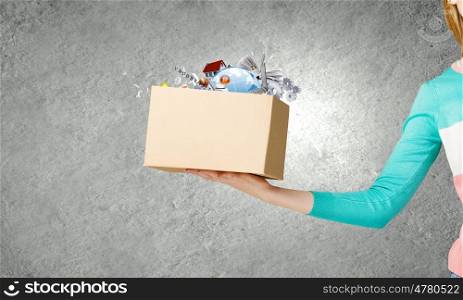 Carton box. Close up of woman hand holding carton box