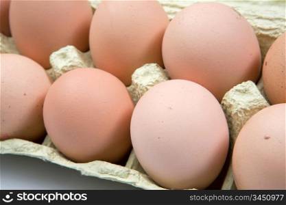 Carton of eggs with a dozen of hen eggs