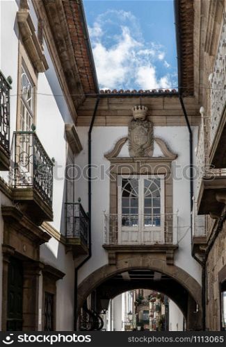 Carved balconies on traditional houses near the main square in Guimaraes. Balconies of traditional houses in Guimaraes in Portugal