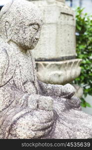 Carved Buddha statue at an Asian Buddhist Temple