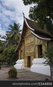 Carved Facade of Buddhist temple, Wat Xieng Thong temple, Luang Prabang, Laos
