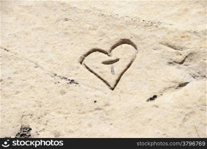 Carved heart with initials in the rock