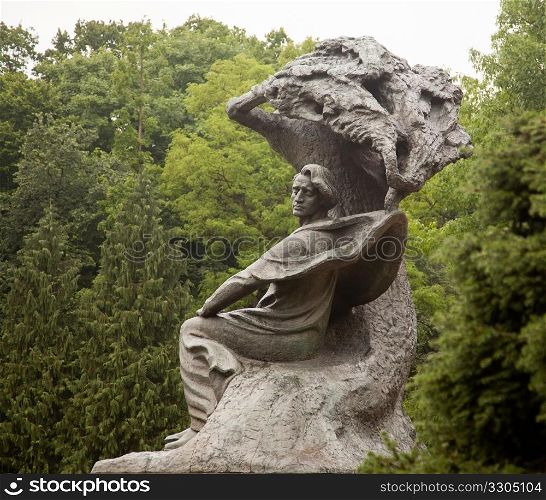 Carved statue of Frederick Chopin in Royal Park in Warsaw Poland